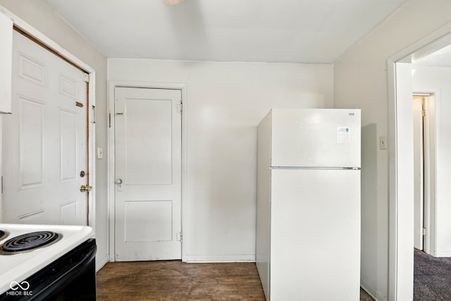 1235 N Grant Ave, Indianapolis, IN 46201 - kitchen featuring freestanding refrigerator, dark wood finished floors, range with electric stovetop, and light countertops