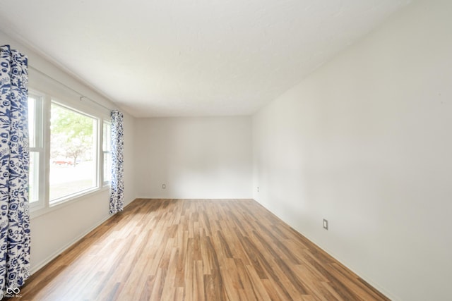 empty room with light wood finished floors