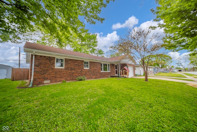 ranch-style home with concrete driveway, an attached garage, brick siding, and a front yard