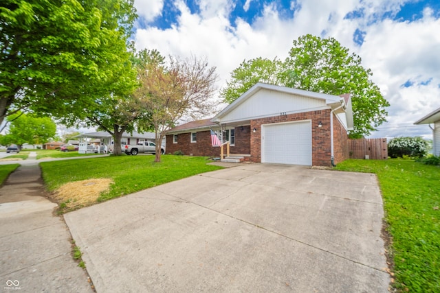 single story home featuring fence, an attached garage, brick siding, driveway, and a front yard