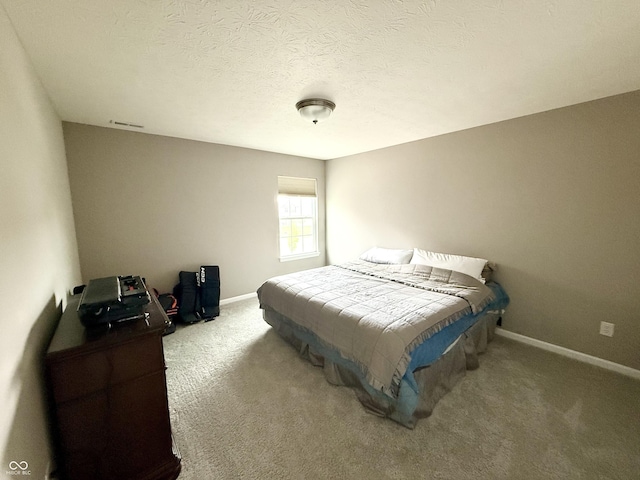 bedroom with carpet flooring, visible vents, and baseboards