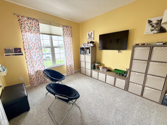 sitting room with carpet and baseboards