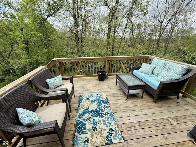 wooden deck with an outdoor living space