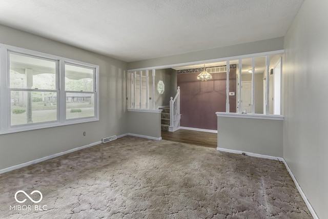 3134 W Hickory Woods Dr, Greenfield, IN 46140 - carpeted spare room with a chandelier, baseboards, and stairs