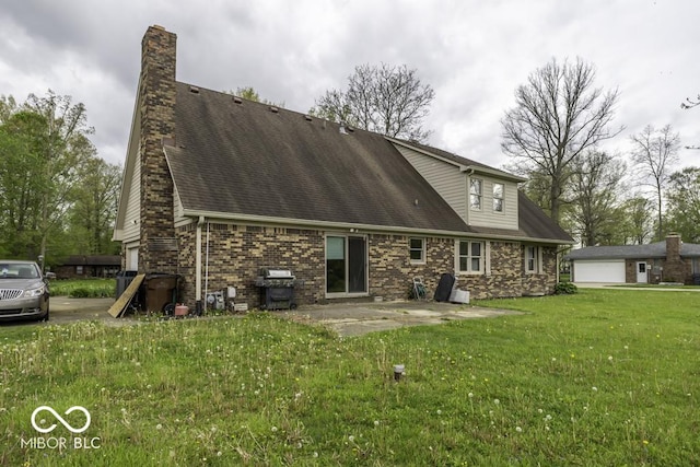 3134 W Hickory Woods Dr, Greenfield, IN 46140 - back of house featuring a lawn, a chimney, a patio area, and a garage