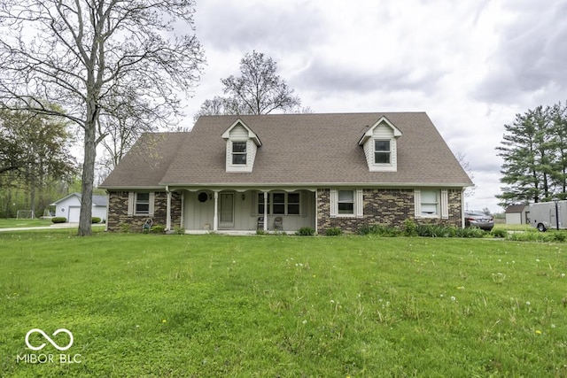 3134 W Hickory Woods Dr, Greenfield, IN 46140 - cape cod-style house with a porch, a front yard, a detached garage, a shingled roof, and stone siding