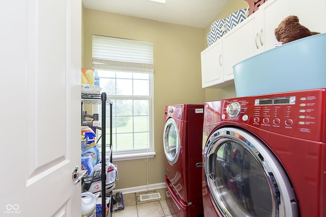 6839 Powder Dr, Indianapolis, IN 46259 - clothes washing area with cabinet space, washer and dryer, plenty of natural light, and baseboards