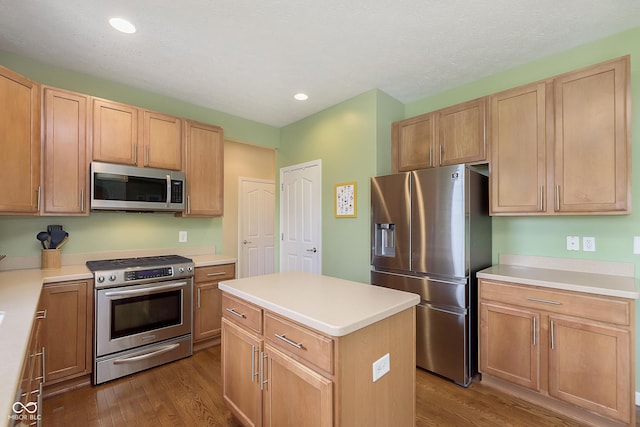 6839 Powder Dr, Indianapolis, IN 46259 - kitchen with appliances with stainless steel finishes, wood finished floors, light countertops, and recessed lighting