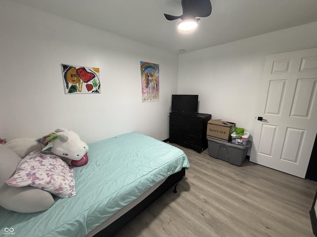 bedroom featuring wood finished floors