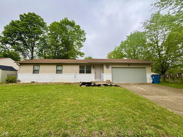 ranch-style home featuring an attached garage, a front lawn, brick siding, and driveway