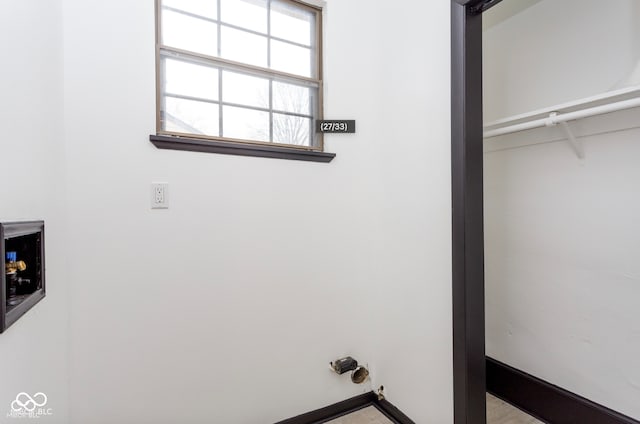 laundry room with laundry area and baseboards