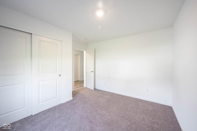 509 Tulip Tree Dr, Lapel, IN 46051 - unfurnished bedroom with carpet floors, baseboards, and a closet
