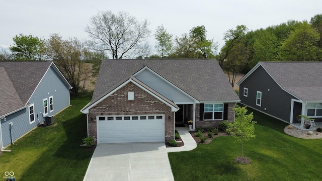 509 Tulip Tree Dr, Lapel, IN 46051 - view of front facade featuring an attached garage, concrete driveway, brick siding, and a front lawn