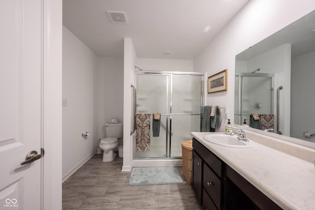 509 Tulip Tree Dr, Lapel, IN 46051 - bathroom with toilet, a shower stall, vanity, and baseboards