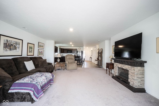 509 Tulip Tree Dr, Lapel, IN 46051 - living area with light carpet, recessed lighting, and a fireplace