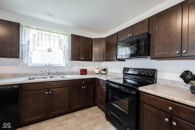 509 Tulip Tree Dr, Lapel, IN 46051 - kitchen featuring black appliances, a sink, light countertops, and dark brown cabinetry