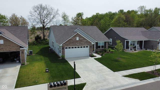 509 Tulip Tree Dr, Lapel, IN 46051 - ranch-style home featuring concrete driveway, brick siding, a front lawn, and an attached garage