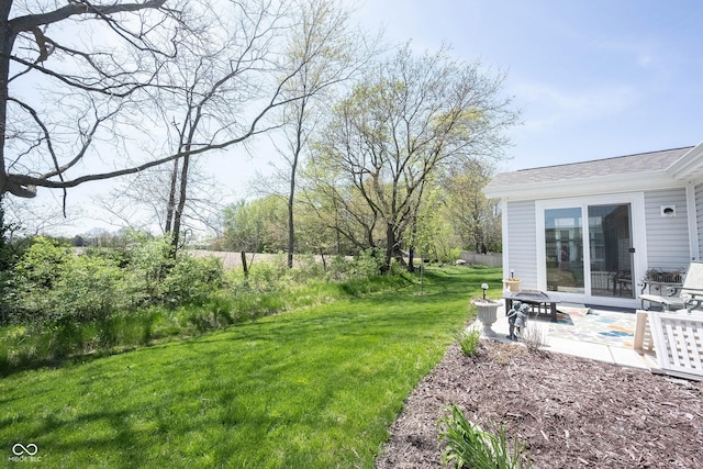 509 Tulip Tree Dr, Lapel, IN 46051 - view of green lawn featuring an outdoor fire pit and a patio