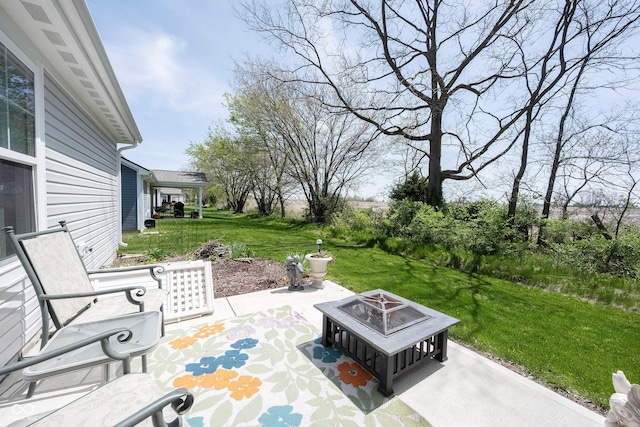 509 Tulip Tree Dr, Lapel, IN 46051 - view of patio featuring an outdoor fire pit