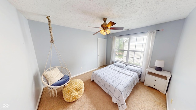 18247 Kinder Oak Dr, Noblesville, IN 46062 - bedroom with light colored carpet, baseboards, a textured ceiling, and a ceiling fan