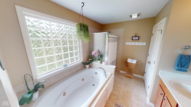 18247 Kinder Oak Dr, Noblesville, IN 46062 - full bath featuring a stall shower, a tub with jets, a textured ceiling, vanity, and baseboards