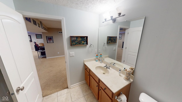 18247 Kinder Oak Dr, Noblesville, IN 46062 - bathroom featuring vanity, toilet, a textured ceiling, tile patterned flooring, and baseboards