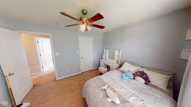 18247 Kinder Oak Dr, Noblesville, IN 46062 - bedroom with light carpet, a textured ceiling, ceiling fan, and baseboards