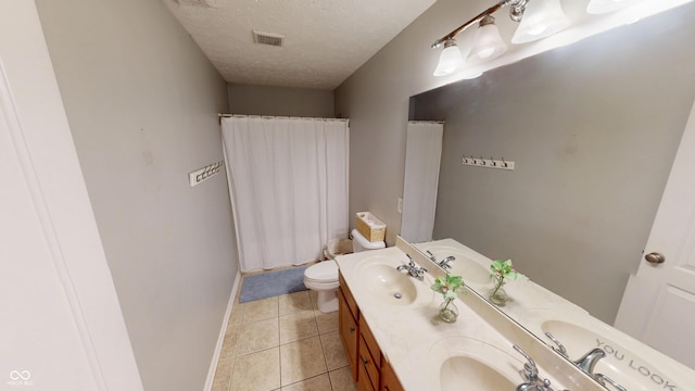 18247 Kinder Oak Dr, Noblesville, IN 46062 - bathroom with a textured ceiling, tile patterned floors, double vanity, curtained shower, and toilet