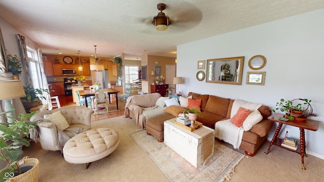 18247 Kinder Oak Dr, Noblesville, IN 46062 - living room with ceiling fan, a textured ceiling, and light carpet