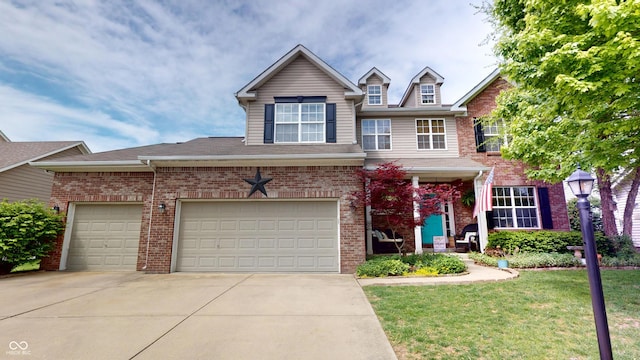 18247 Kinder Oak Dr, Noblesville, IN 46062 - view of front facade with driveway, brick siding, a front lawn, and a garage