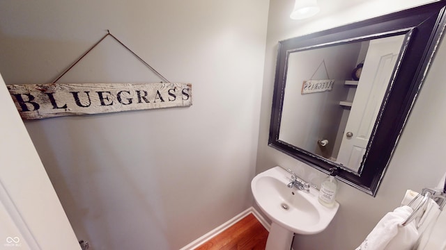 18247 Kinder Oak Dr, Noblesville, IN 46062 - bathroom featuring a sink, wood finished floors, and baseboards