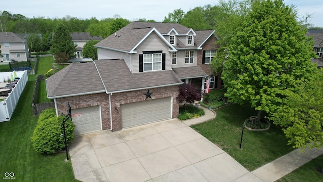18247 Kinder Oak Dr, Noblesville, IN 46062 - traditional-style home with brick siding, concrete driveway, roof with shingles, and a garage