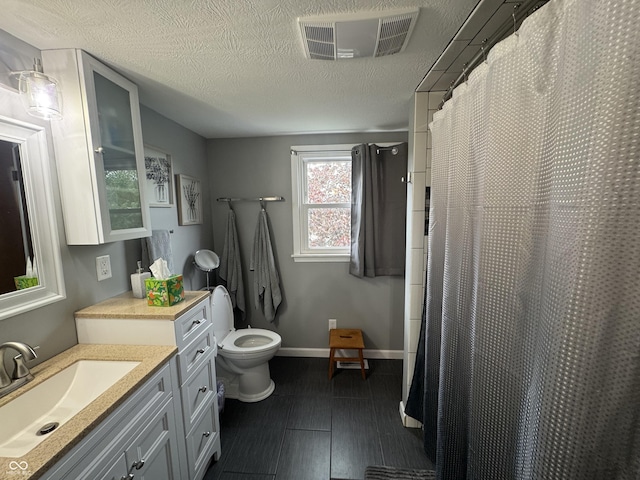 bathroom featuring toilet, vanity, baseboards, and a shower with curtain