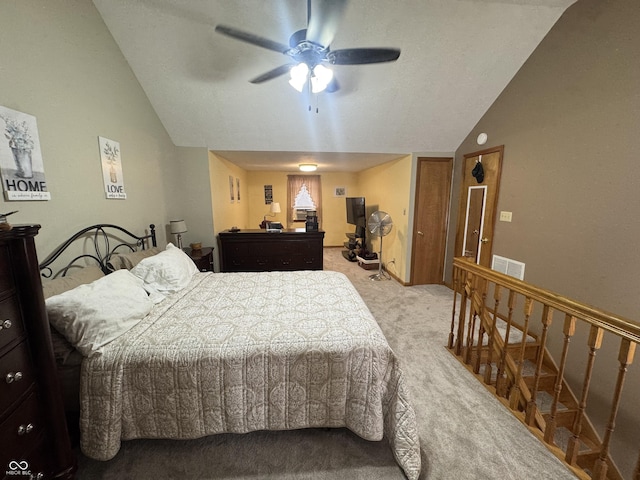 bedroom featuring vaulted ceiling and light carpet