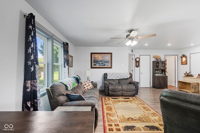 living room with ceiling fan, recessed lighting, and wood finished floors