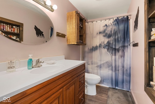 full bathroom with vanity, toilet, a shower with curtain, and wood finished floors