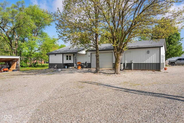 view of front of house featuring metal roof and an attached garage