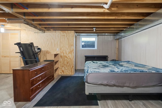 bedroom with wooden walls