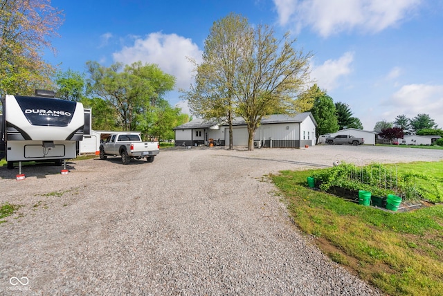 view of road featuring gravel driveway