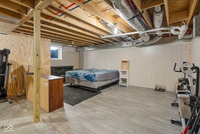bedroom featuring visible vents and wood finished floors