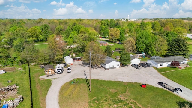 drone / aerial view featuring a forest view