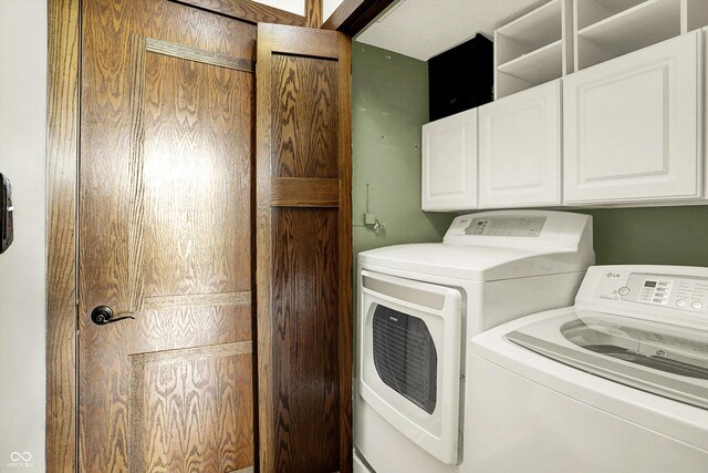 6505 Miramar Ct, Indianapolis, IN 46250 - laundry area with washer and dryer and cabinet space