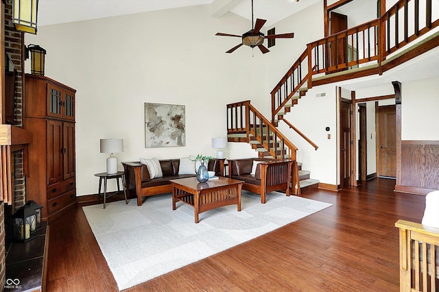 6505 Miramar Ct, Indianapolis, IN 46250 - living area with wood finished floors, high vaulted ceiling, stairway, a ceiling fan, and baseboards