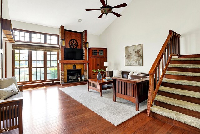 6505 Miramar Ct, Indianapolis, IN 46250 - living area featuring high vaulted ceiling, a ceiling fan, healthy amount of natural light, stairs, and wood finished floors