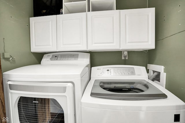 6505 Miramar Ct, Indianapolis, IN 46250 - laundry area with cabinet space and washing machine and clothes dryer
