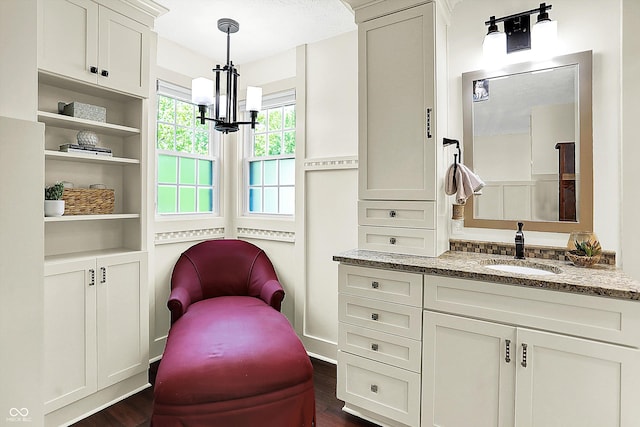 6505 Miramar Ct, Indianapolis, IN 46250 - sitting room with a chandelier and dark wood-type flooring
