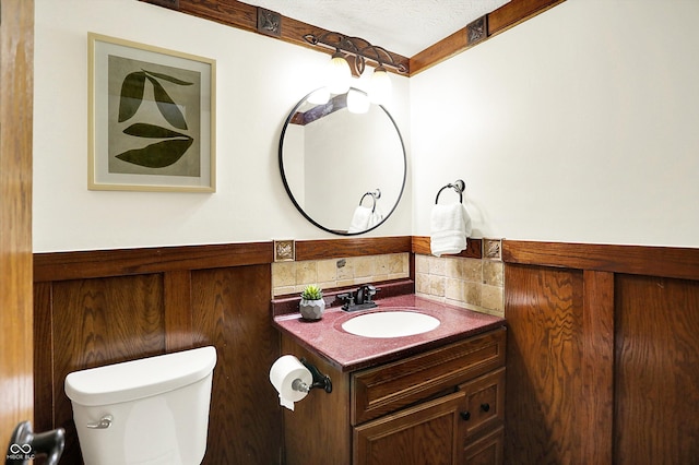 6505 Miramar Ct, Indianapolis, IN 46250 - half bathroom with wainscoting, toilet, and vanity