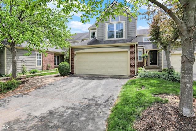 6505 Miramar Ct, Indianapolis, IN 46250 - traditional-style home featuring asphalt driveway, brick siding, and an attached garage