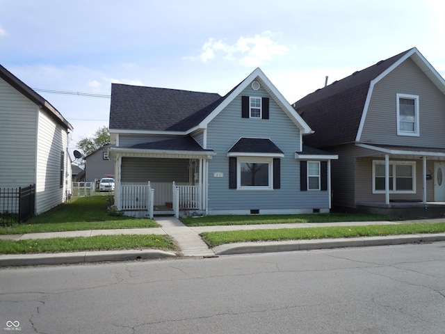 view of front of property with crawl space, fence, a shingled roof, a front lawn, and a porch