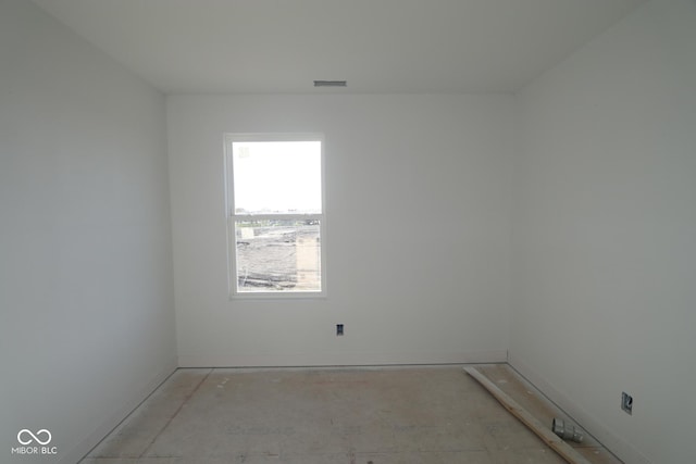 empty room featuring baseboards